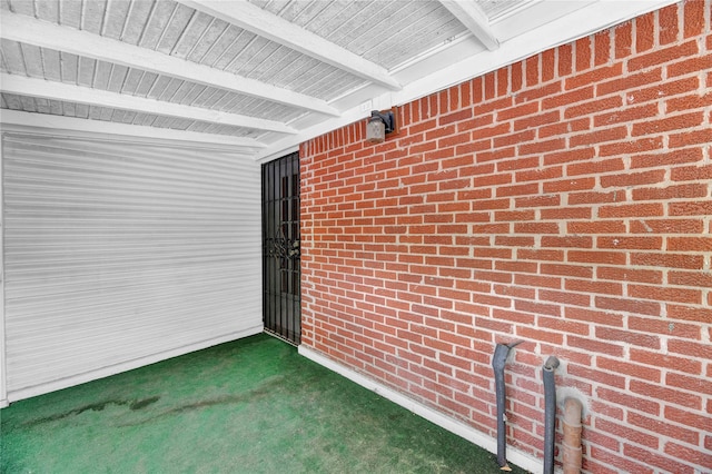 exterior space with brick siding