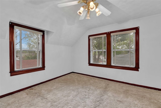 bonus room with carpet, lofted ceiling, baseboards, and a ceiling fan