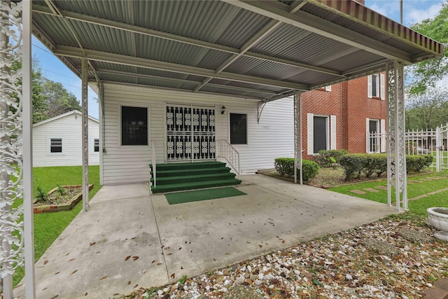 back of house featuring entry steps and a yard