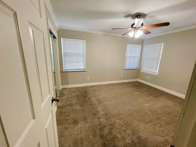 unfurnished bedroom with crown molding, ceiling fan, and carpet floors