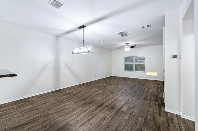 empty room featuring dark hardwood / wood-style floors and ceiling fan