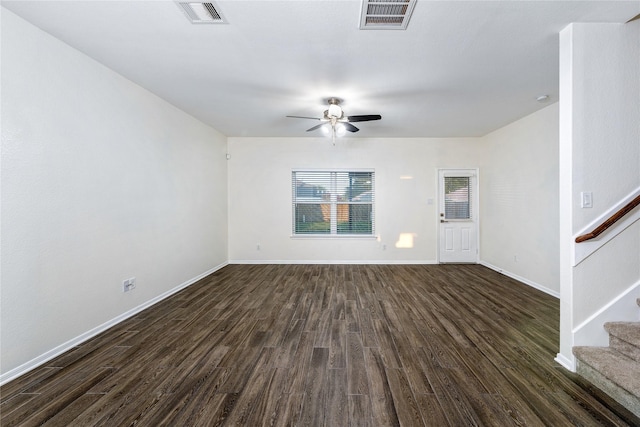 unfurnished room featuring dark wood-type flooring and ceiling fan