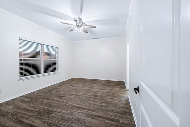 empty room with crown molding, dark hardwood / wood-style floors, and ceiling fan