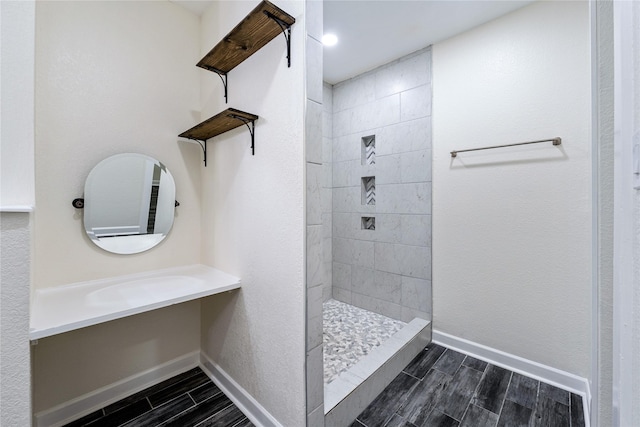 bathroom featuring a tile shower