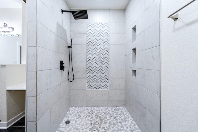 bathroom with tiled shower