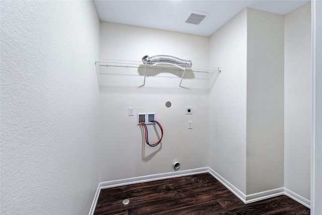 clothes washing area with gas dryer hookup, electric dryer hookup, washer hookup, and dark hardwood / wood-style flooring