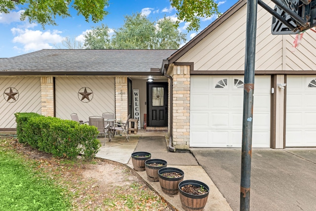 view of exterior entry featuring a garage