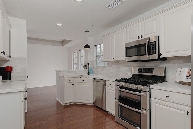 kitchen with white cabinetry, sink, and appliances with stainless steel finishes