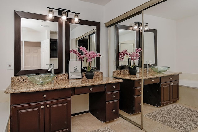 bathroom with vanity and tile patterned flooring