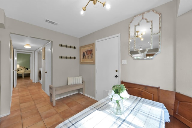 tiled dining space featuring washer / dryer