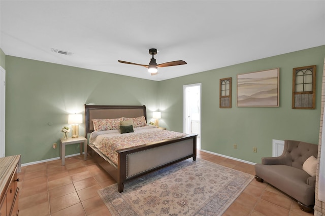 bedroom with ceiling fan and light tile patterned floors