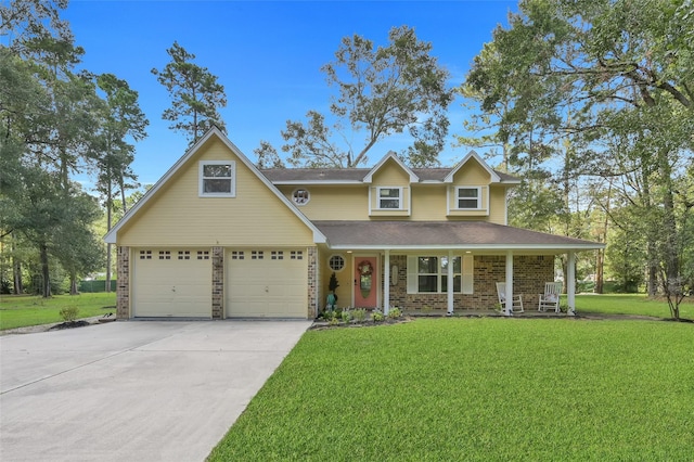 view of front of house with a garage, covered porch, and a front lawn