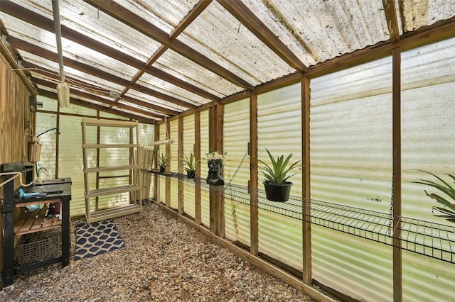 sunroom / solarium featuring vaulted ceiling