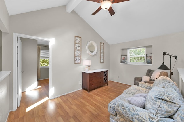 living area with ceiling fan, high vaulted ceiling, beam ceiling, and light hardwood / wood-style floors