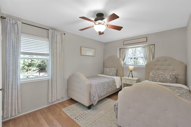 bedroom featuring ceiling fan and light wood-type flooring