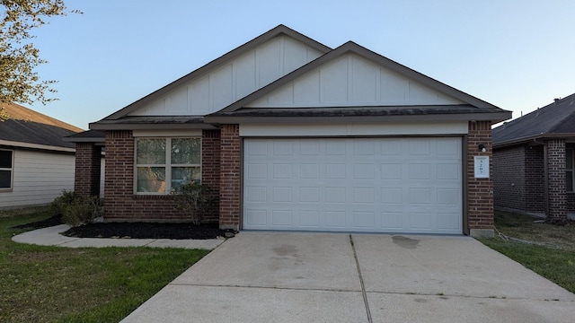 ranch-style home featuring a garage, concrete driveway, board and batten siding, and brick siding