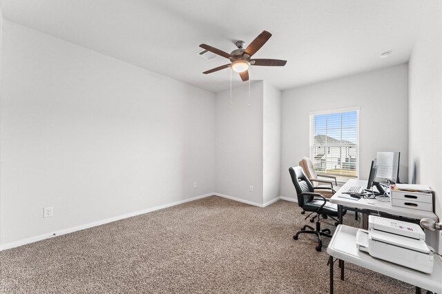 carpeted office featuring ceiling fan, visible vents, and baseboards