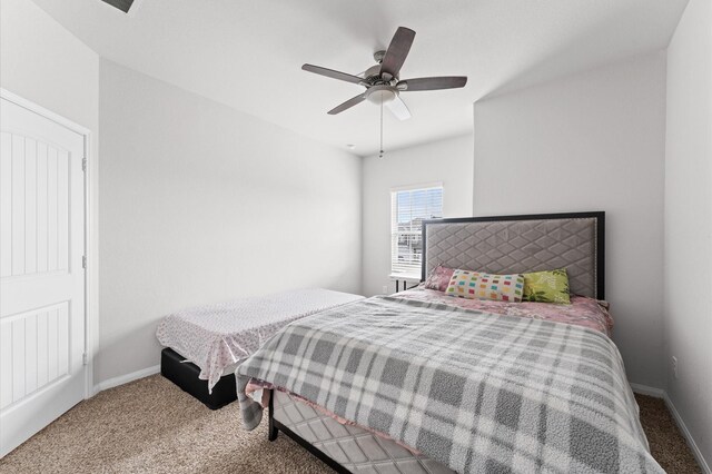 carpeted bedroom featuring a ceiling fan and baseboards