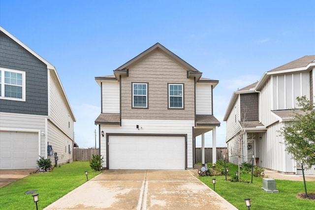 traditional home featuring a garage, a front yard, fence, and driveway