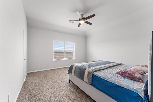 carpeted bedroom with ceiling fan, visible vents, and baseboards