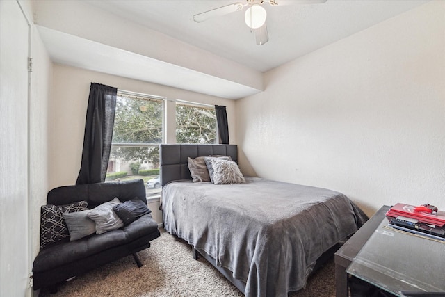 bedroom featuring ceiling fan and carpet floors