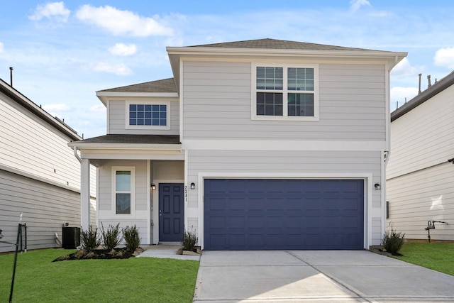 traditional home with central AC unit, a garage, a shingled roof, concrete driveway, and a front yard