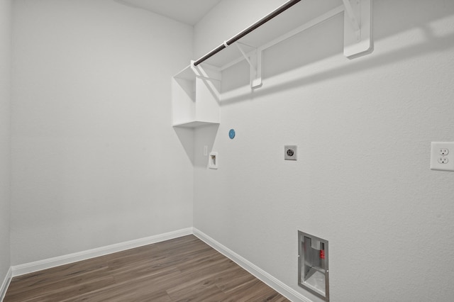 laundry room featuring hookup for a gas dryer, laundry area, electric dryer hookup, and baseboards