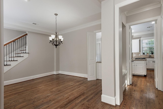 unfurnished dining area featuring an inviting chandelier, sink, dark wood-type flooring, and ornamental molding