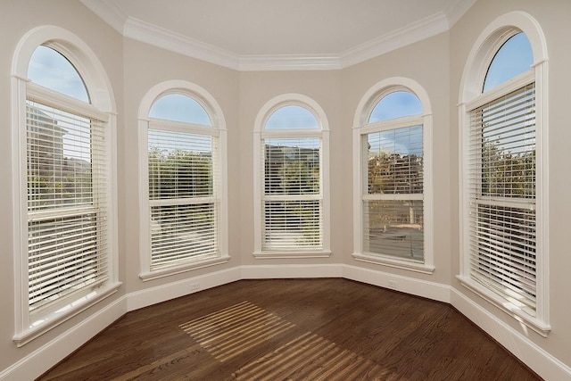 unfurnished dining area with dark hardwood / wood-style flooring and crown molding