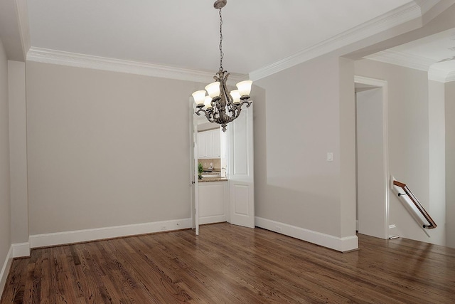 unfurnished dining area featuring ornamental molding, dark hardwood / wood-style floors, and a chandelier