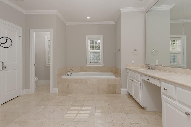 bathroom with crown molding, vanity, toilet, and tiled tub