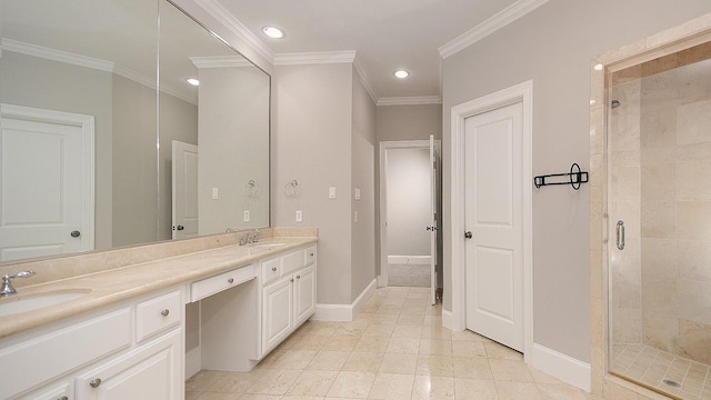 bathroom with vanity, crown molding, and walk in shower