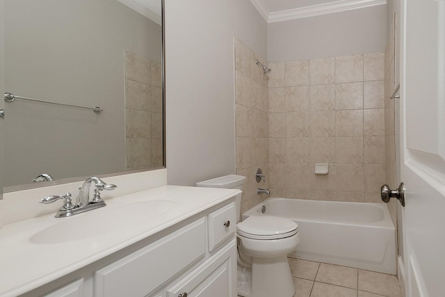 full bathroom with tile patterned flooring, vanity, ornamental molding, tiled shower / bath, and toilet