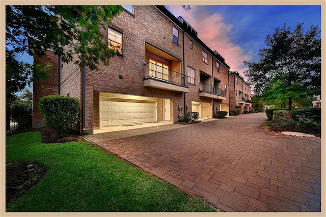 outdoor building at dusk with a garage