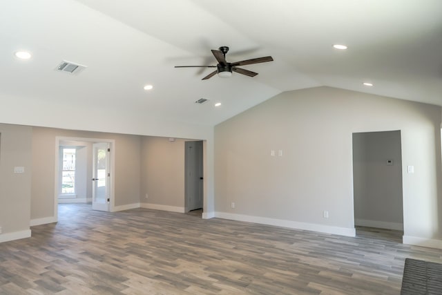 unfurnished room with hardwood / wood-style flooring, ceiling fan, and vaulted ceiling