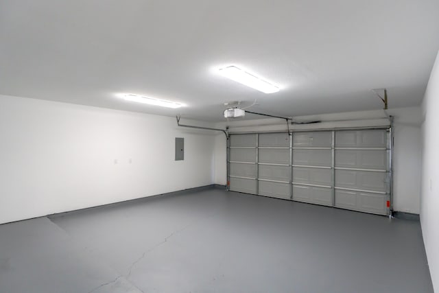 garage featuring a garage door opener and electric panel