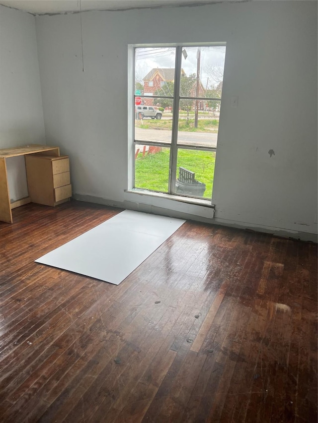 spare room featuring dark hardwood / wood-style floors