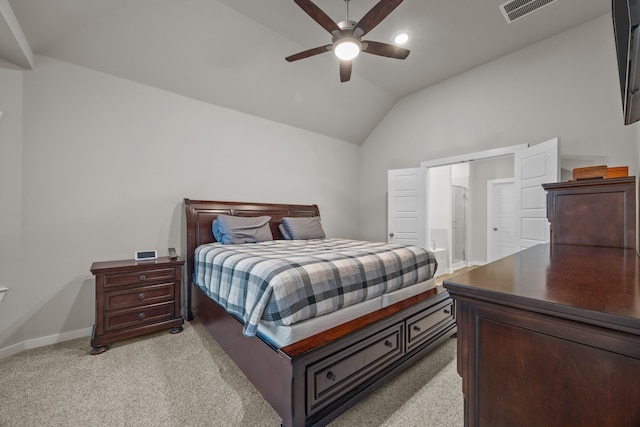 carpeted bedroom featuring ceiling fan, lofted ceiling, and ensuite bathroom