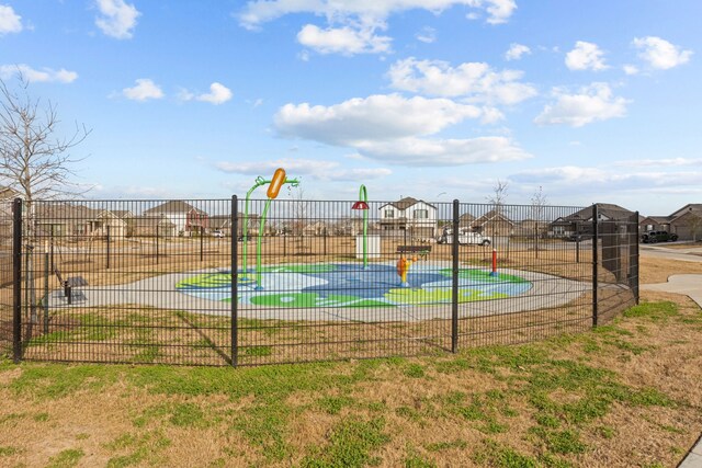 view of basketball court featuring a yard