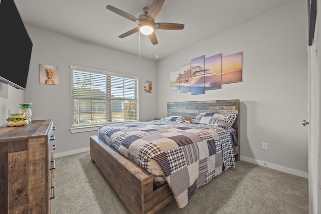 bedroom featuring light colored carpet and ceiling fan