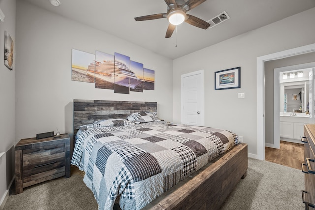 bedroom with ceiling fan and dark colored carpet