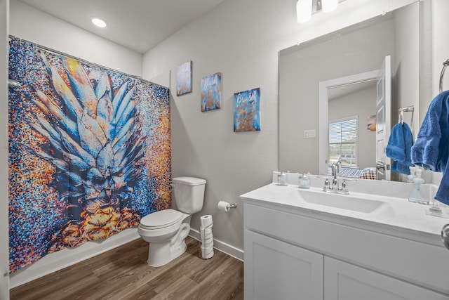 bathroom with wood-type flooring, toilet, a shower with shower curtain, and vanity