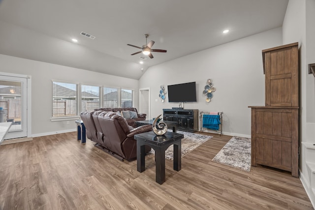 living room featuring ceiling fan, lofted ceiling, and hardwood / wood-style floors