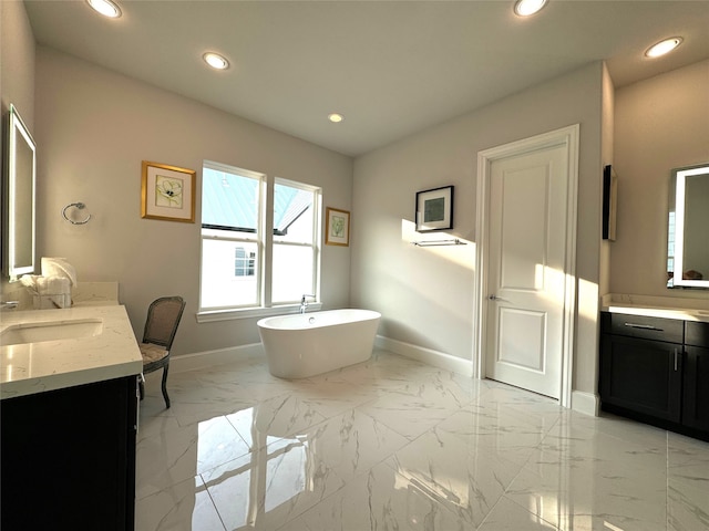 bathroom with vanity and a bathing tub