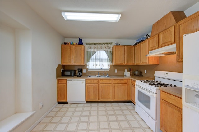 kitchen featuring white appliances and sink