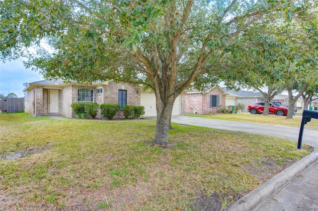 view of front of property with a garage and a front lawn