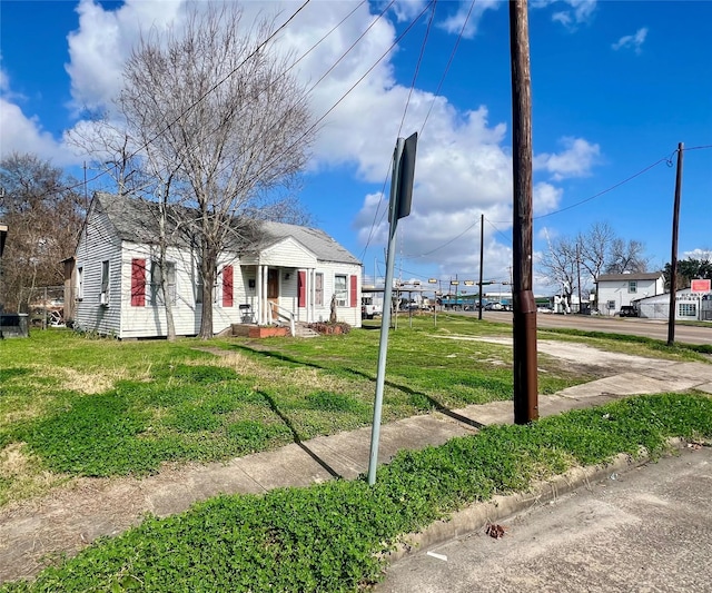 bungalow with a front yard