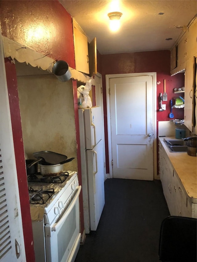 kitchen with white appliances and sink