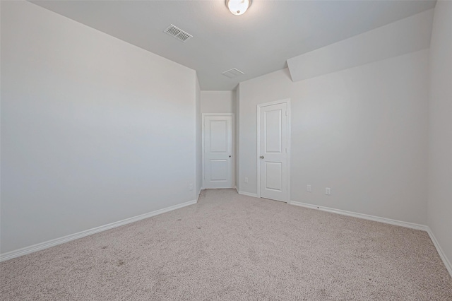 empty room featuring carpet floors