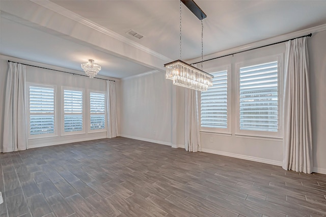 empty room featuring a notable chandelier, dark wood-type flooring, and crown molding